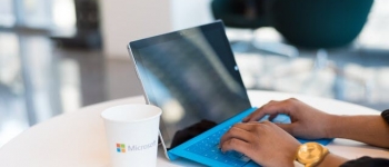 Person using blue microsoft surface